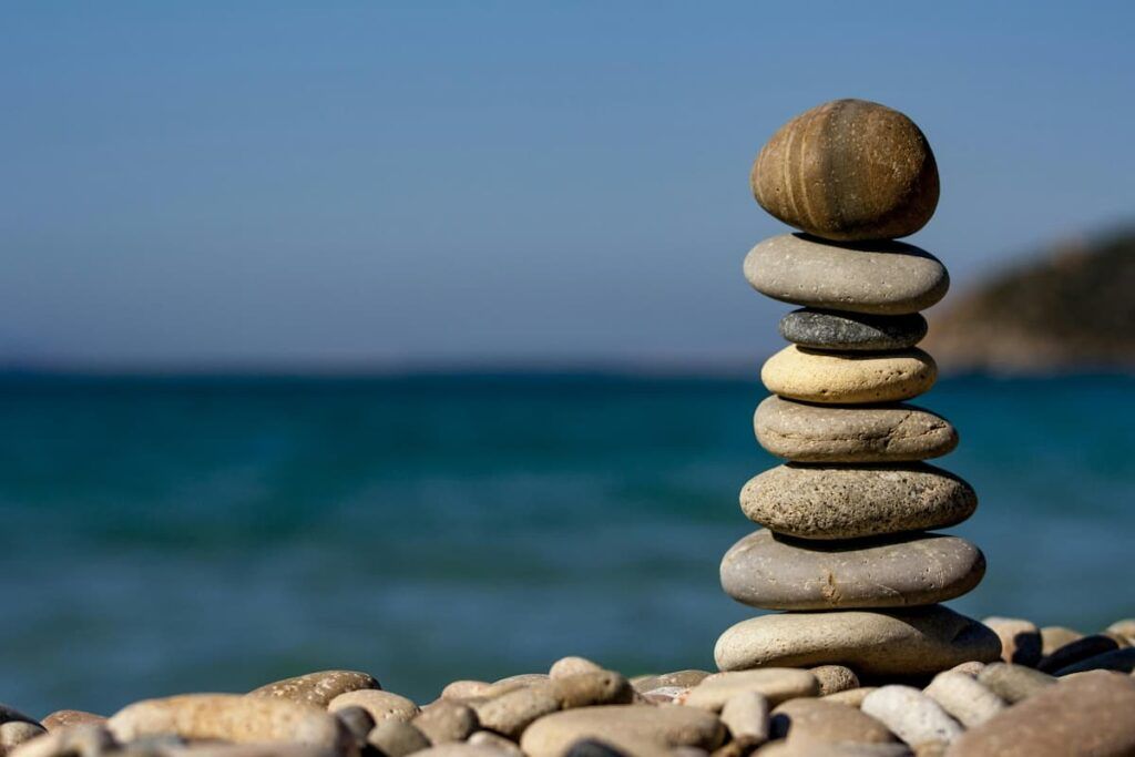 finding balance a pile of stones on sea shore